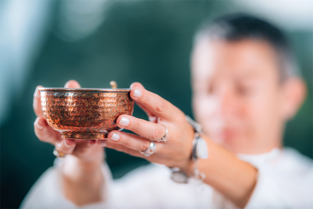 hands making an offering