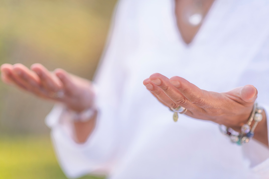 woman holding her hands in a balancing gesture