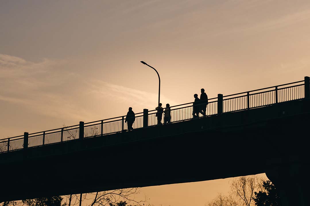 people-on-a-bridge-in-twilight