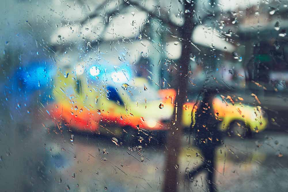 emergency and public service workers ambulance in the rain