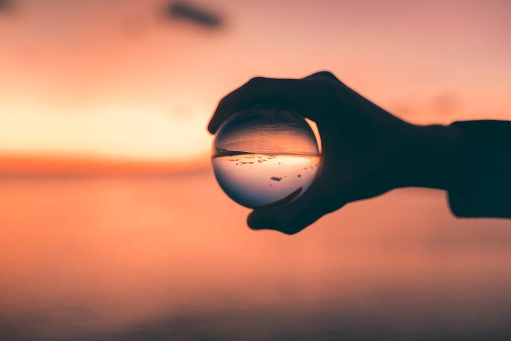 a glass globe held in a hand