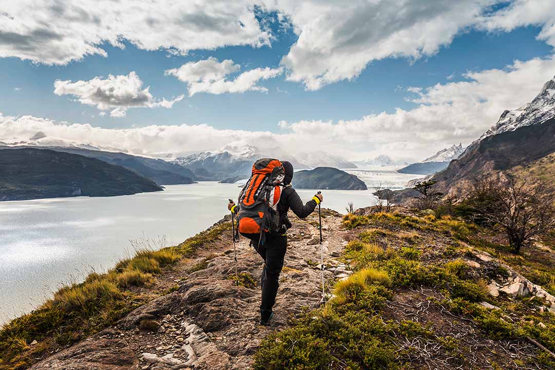 person walking along a rough path